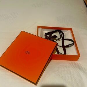 Hermes box with tissue paper and ribbon